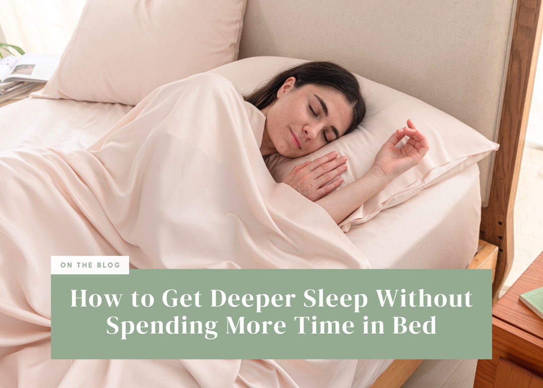 Woman sleeping comfortably under soft blush-pink bedding.