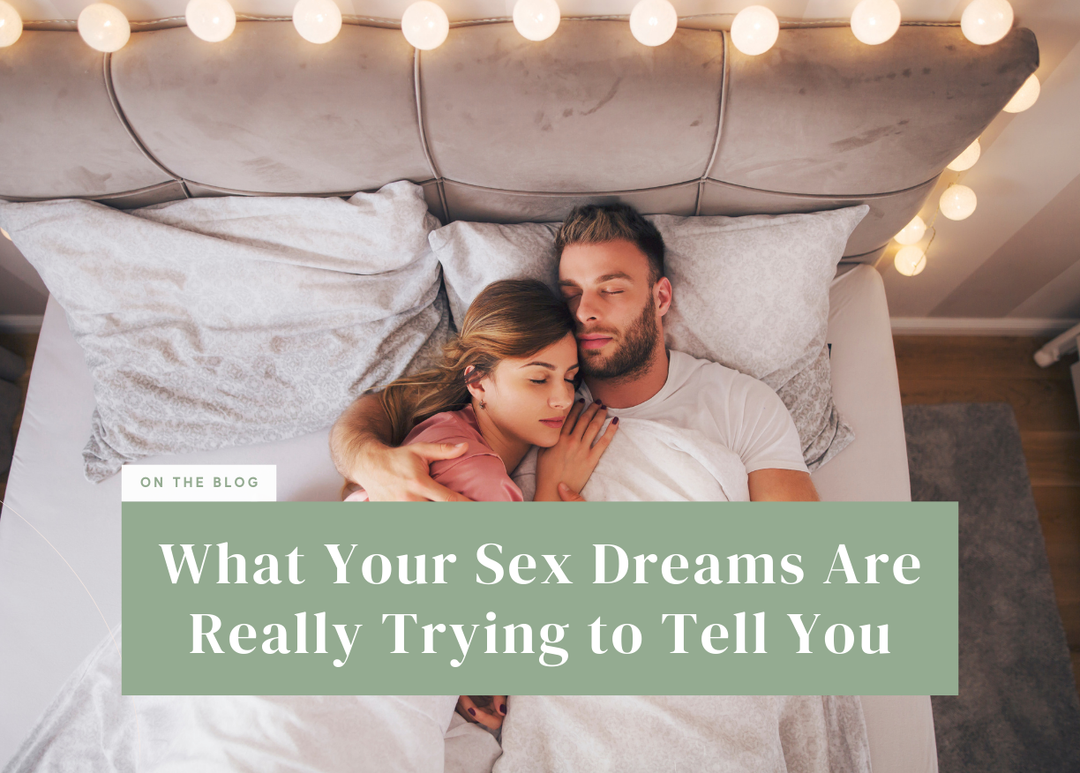Overhead view of a couple sleeping peacefully in bed together under white bedding.