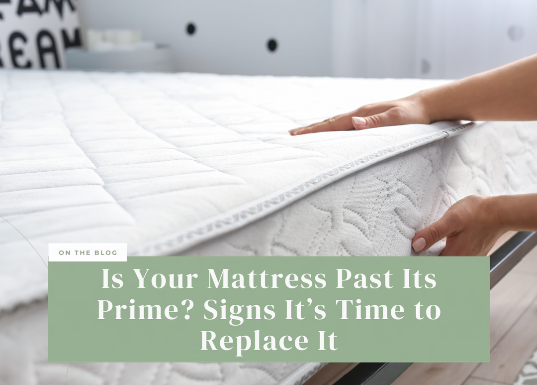 Hands inspecting and adjusting the quilted top edge of a white mattress.