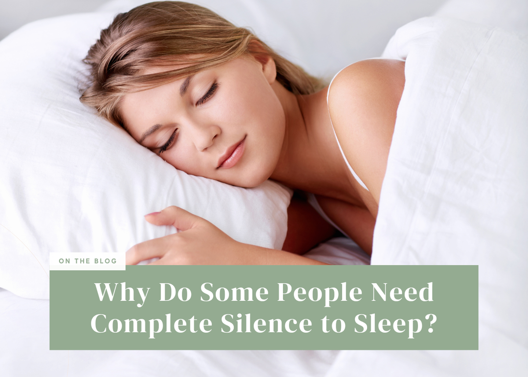 Woman sleeping peacefully on a white pillow in bed.