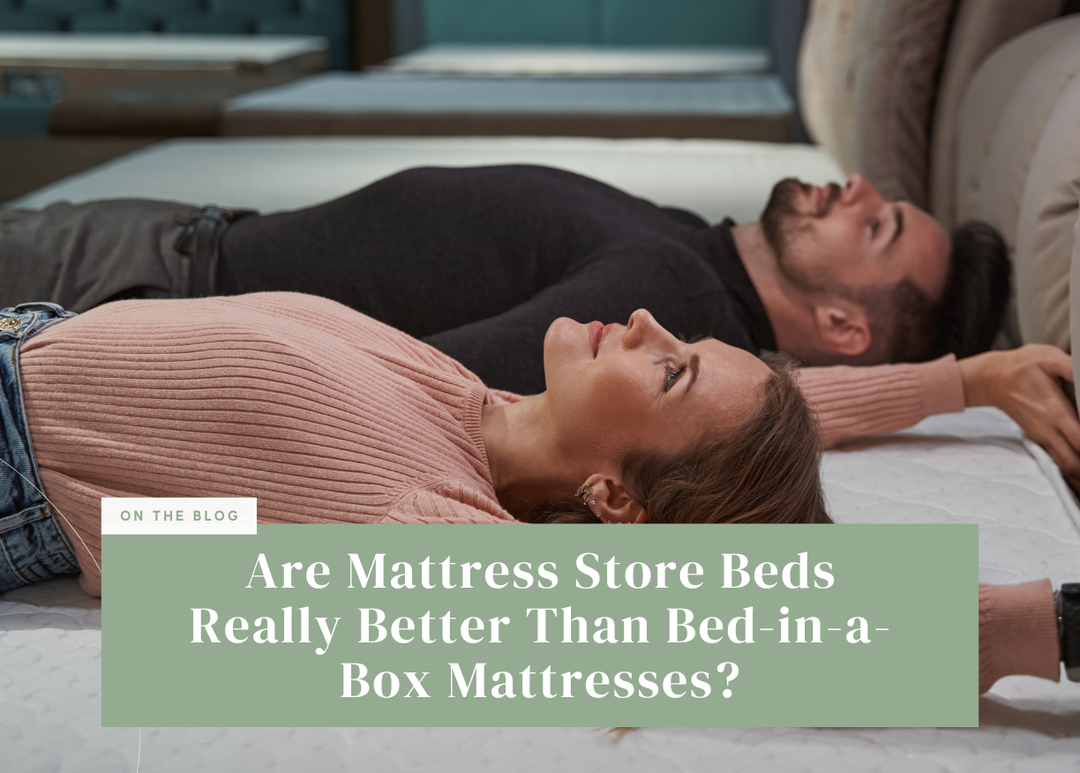 Couple lying down testing a mattress in a store.
