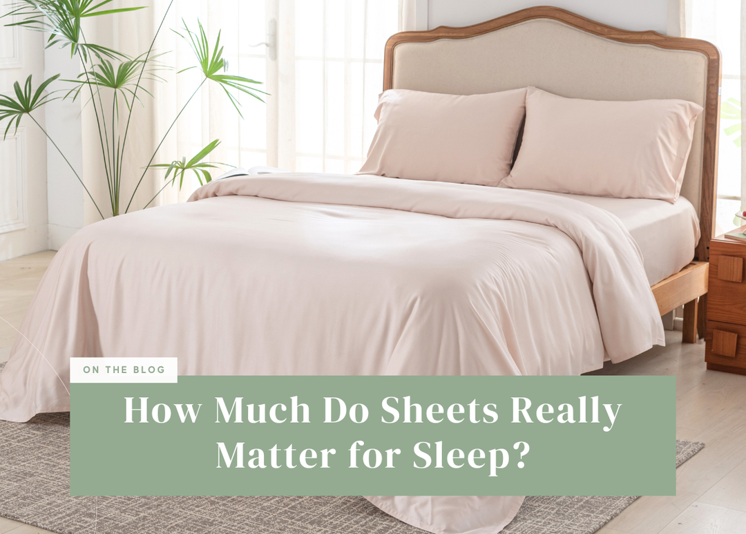 Light pink bamboo sheet set neatly arranged on a bed.