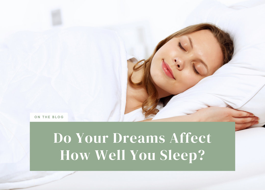 Woman sleeping comfortably on her side on a white pillow with a gentle smile.