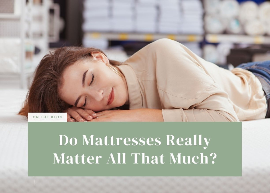 Woman trying out a new mattress by lying on her side in a showroom.