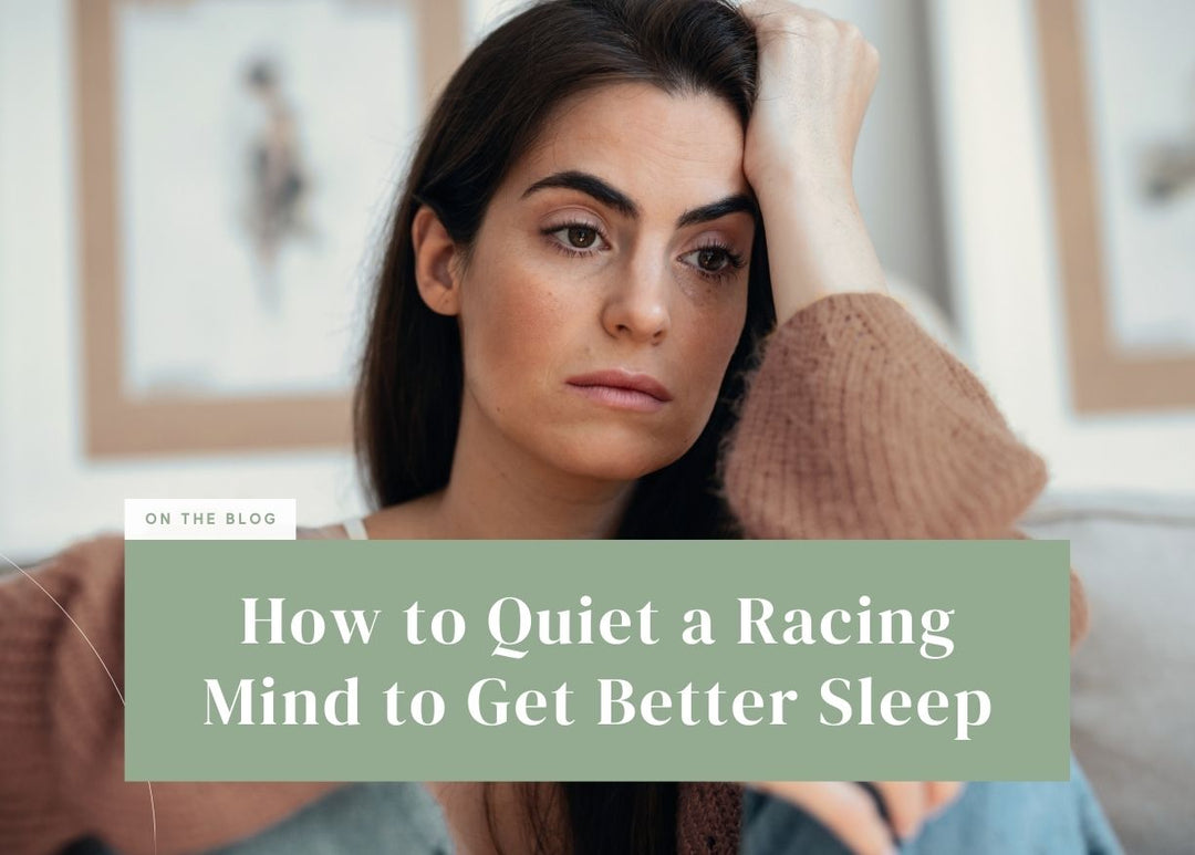 Pensive woman leaning her head on her hand with a worried expression.