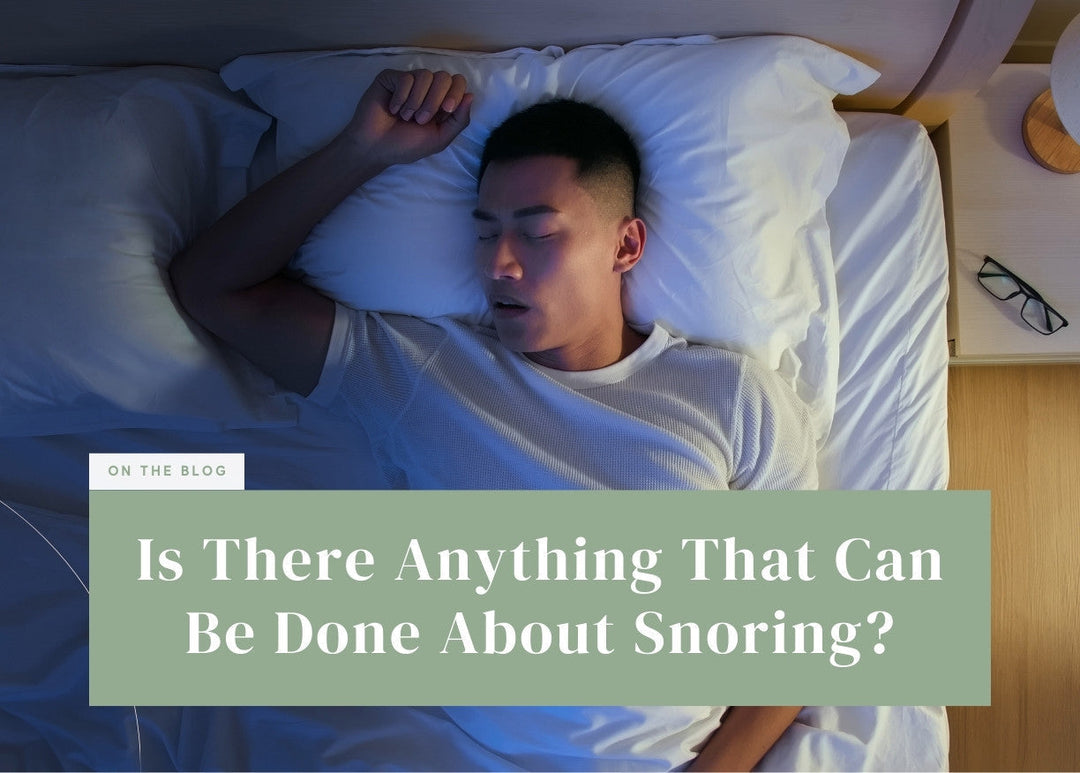Man sleeping on his back with his mouth open under cool night lighting.