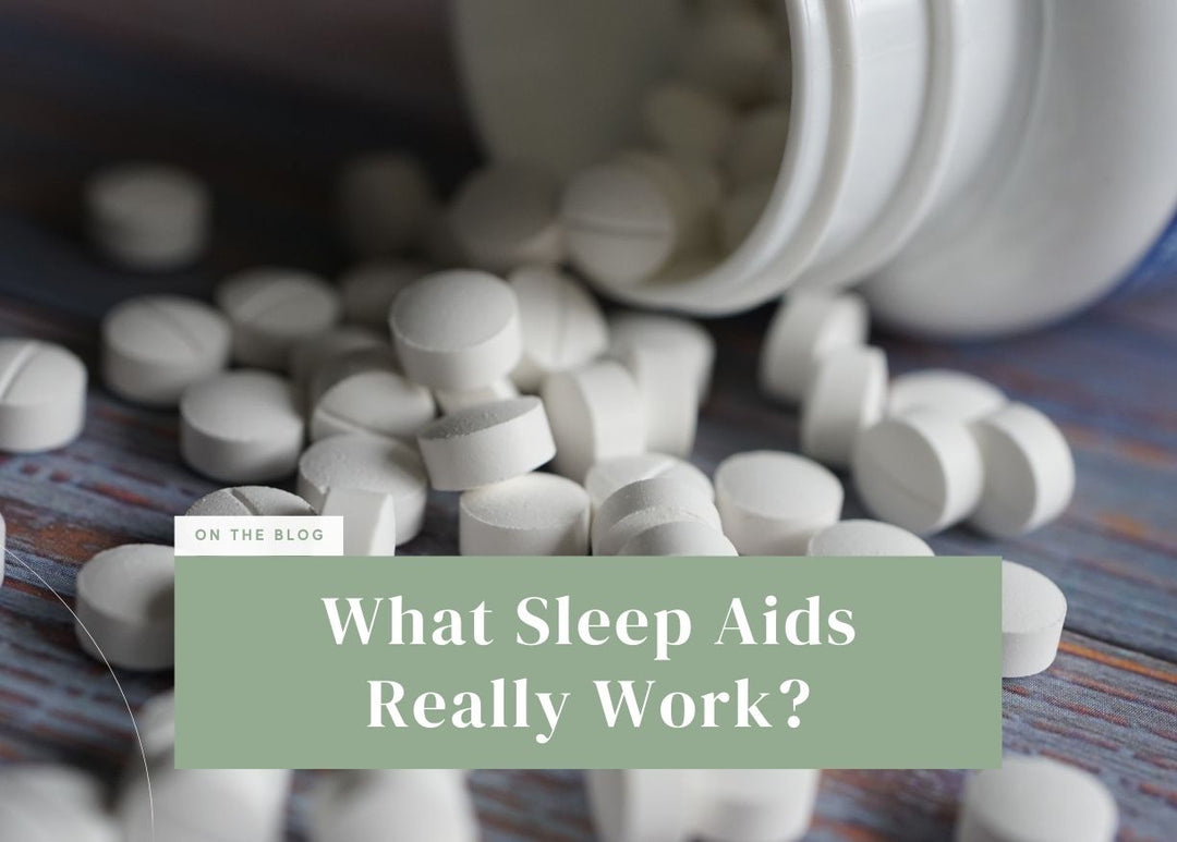 White medicine pills spilling out of an overturned pill bottle.