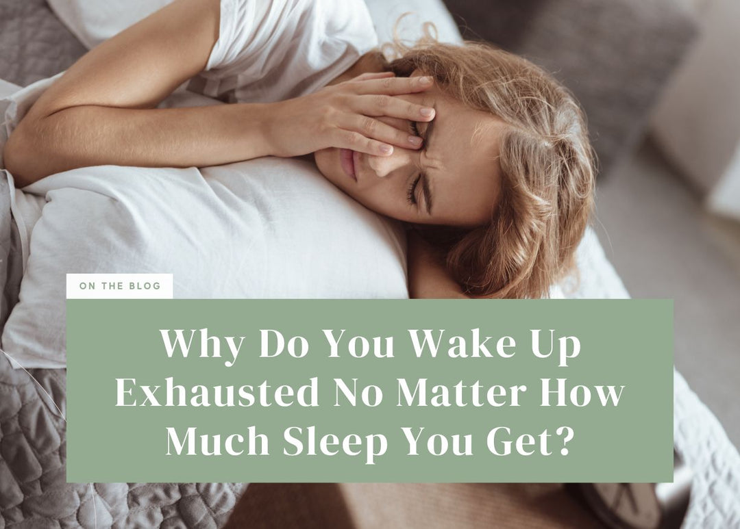 Exhausted woman lying in bed covering her eyes with her hand.
