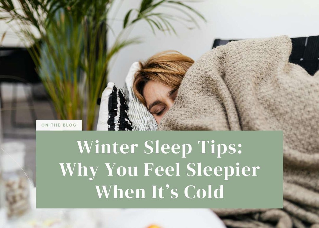 Woman wrapped cozy under a heavy knitted blanket.